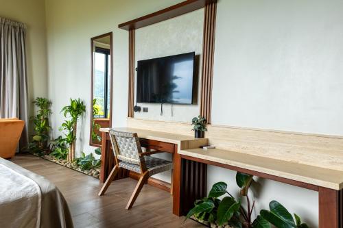 Μια τηλεόραση ή/και κέντρο ψυχαγωγίας στο Villas Jawara ! Un Volcán en su Jardín !