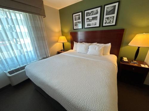 a hotel room with a large bed and a window at Sleep Inn & Suites Manchester near Arnold AFB in Manchester