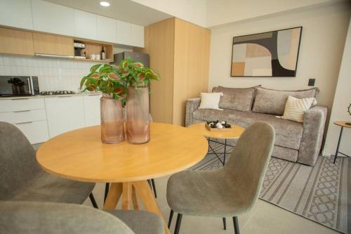 a living room with a table and a couch at MrW Incredible loft in Livify in Guadalajara