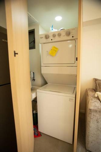 a white washer and dryer in a small room at MrW Incredible loft in Livify in Guadalajara