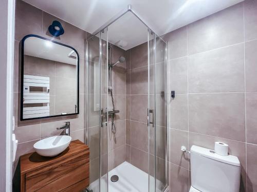 a bathroom with a shower and a toilet and a sink at Le petit Basque, Plage - Bar - Restaurant in Soorts-Hossegor