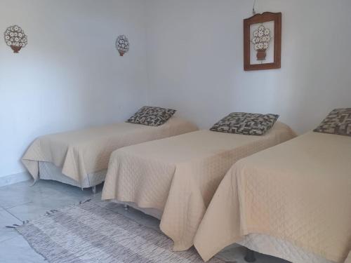 Una cama o camas en una habitación de Hotel Fazenda Chiminelli