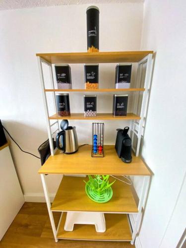 Příslušenství pro přípravu čaje a kávy v ubytování Appartement typique avec Carnotzet