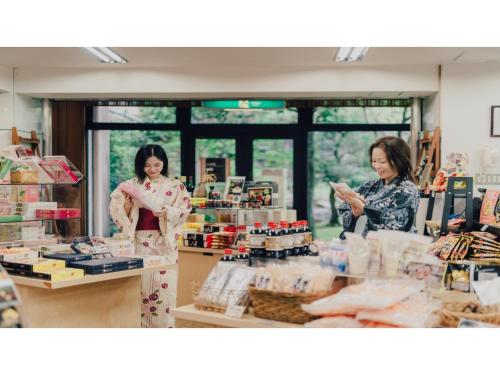 two women standing behind a counter in a store at Tokigasane - Vacation STAY 15860v in Kaga