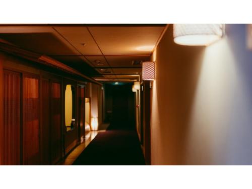 a long hallway with a dark corridor at Tokigasane - Vacation STAY 15860v in Kaga