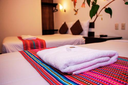 Postel nebo postele na pokoji v ubytování Peru Coca B&B Machupicchu