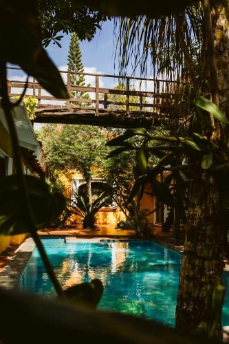 a bridge over a swimming pool with a bridge over it at Villa Amable, Lujo entre Selvas y Lagunas in Akumal