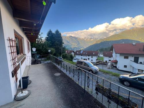 a balcony of a house with a view of mountains at Pension Razil in Ladis