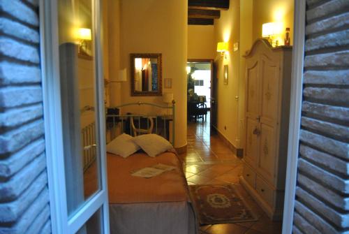 a hallway with a door leading to a room at Mondo Antico B&B in Cesena