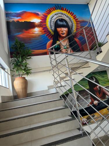 a mural on the side of a stairway in a building at HOTEL TERRA NATIVA in Alter do Chao