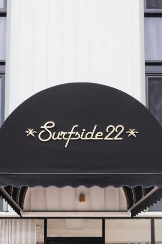 a symbiosis sign on top of a building at Surfside 22 in Wollongong