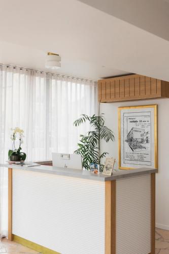 an office with a reception counter and a window at Surfside 22 in Wollongong