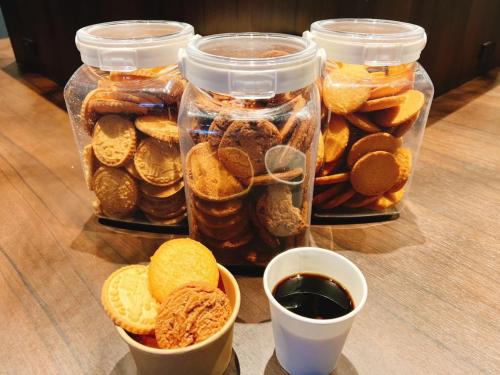 a group of jars filled with different types of food at Henn na Hotel Fukuoka Hakata in Fukuoka