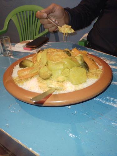 a plate of food on top of a table at Riad Dar Amgdoule Tacheddirt in Tacheddirt