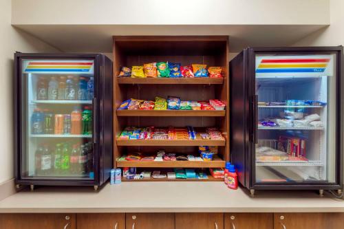 two open refrigerators with food and drinks in them at Best Western Plus St. Paul North/Shoreview in Shoreview