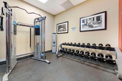 a gym with rows of dumbbells at Best Western Plus St. Paul North/Shoreview in Shoreview