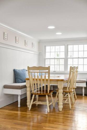 a dining room with a table and two chairs at Retreat by the Hot Tub & Fire Pit, Dog-Friendly! in Brewster