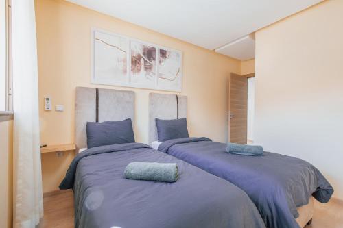 Postel nebo postele na pokoji v ubytování Migdal Gueliz Apart Hôtel