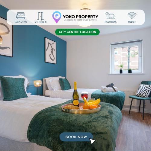 a room with two beds and a table with a bottle of wine at Modern Apartment - Walking Distance to the City Centre - Free Parking, Fast Wi-Fi and Smart TV with Netflix by Yoko Property in Coventry