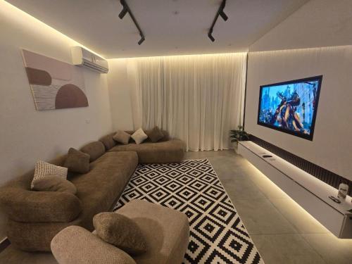 TV a/nebo společenská místnost v ubytování madinaty cozy studio at privado