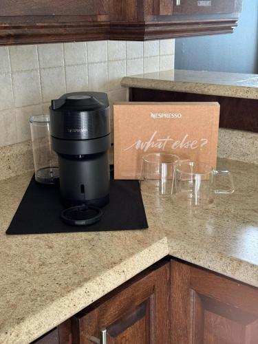 a coffee maker sitting on a kitchen counter at Your Vivid Dwelling in Kelligrews