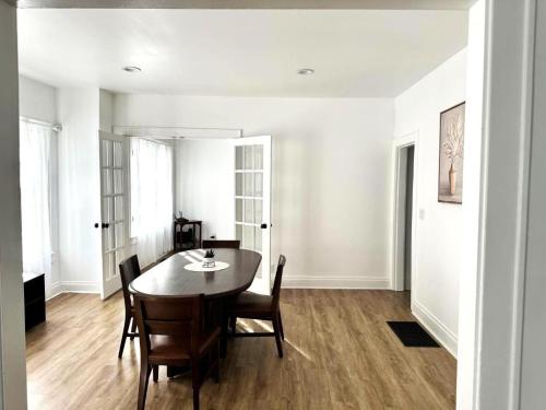 a dining room with a table and chairs at Downtown Retreat - Cozy First Floor in Columbus