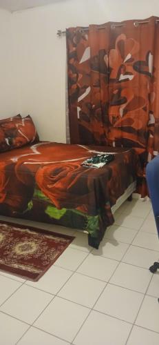 a bedroom with a bed with a blanket on it at Mack's Home in Clifton