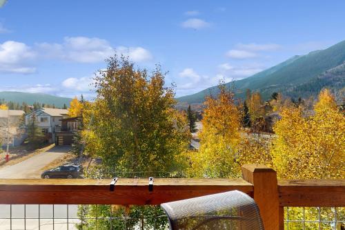 a balcony with a view of the mountains and trees at Bears Den Condo Unit 1 in Frisco