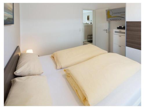 En eller flere senge i et værelse på Holiday apartment Zeppelinstek