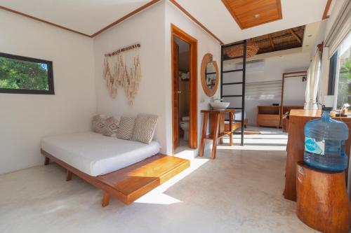 a living room with a couch and a table at Hotel CasaBakal - A pie de Laguna - Bacalar in Bacalar