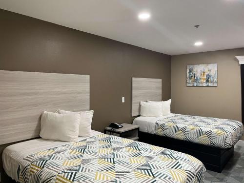 ホーマにあるMotel 6 Houma, LAの2ベッド ホテルルーム 2台付