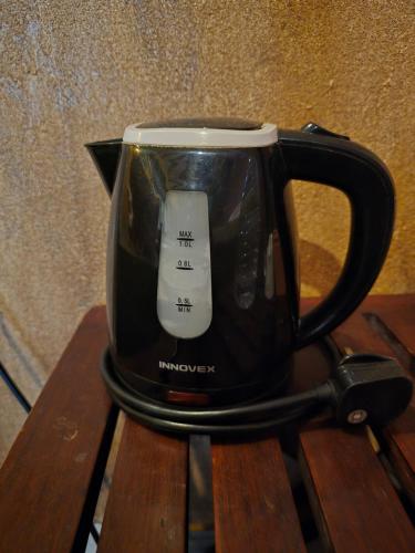 a black coffee mug with a computer mouse on it at Ceylon Resort Wilpattu in Wilpattu