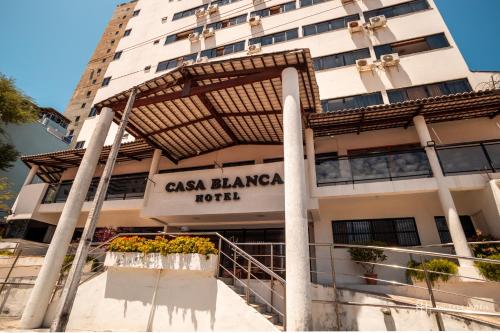 a building with a sign that reads casa flaminga at Rede Andrade Casa Blanca in Fortaleza