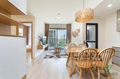 a kitchen and dining room with a table and chairs at Masteri Centre Point - Vihomes serviced apartment in Long Bình