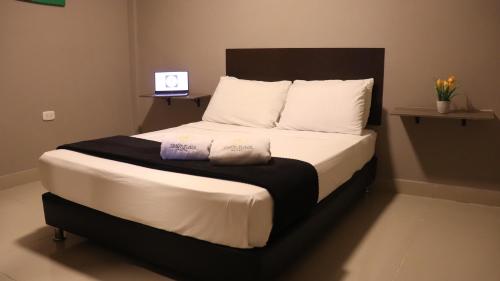 Una cama o camas en una habitación de Hotel Simón Plaza
