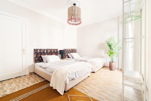 Postel nebo postele na pokoji v ubytování Nabeel Homes Boutique Hotel
