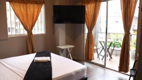 Una cama o camas en una habitación de Hotel Simón Plaza