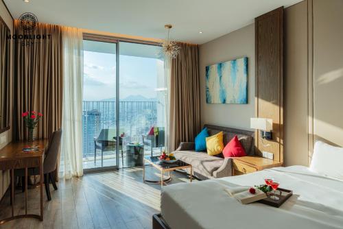 a hotel room with a bed and a couch at Nha Trang Superview Holidays in Nha Trang