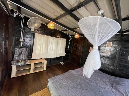 Кровать или кровати в номере The Legend Homestay.