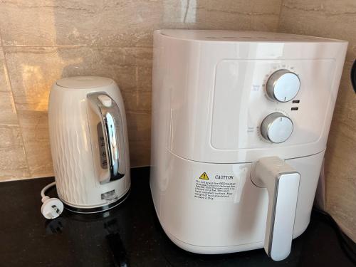 a white coffee maker sitting on top of a counter at Number 29 Adelaide Street in Fremantle