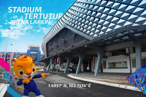 a cartoon sonic mascot standing in front of a building at Arfaan Guest House in Skudai