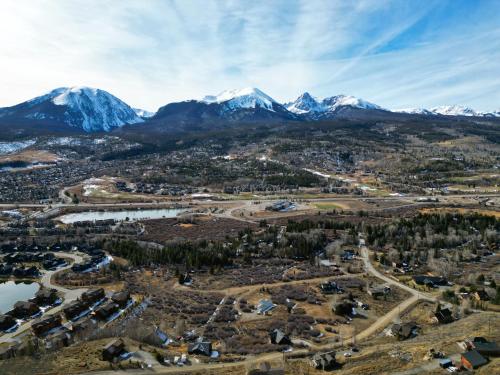 an aerial view of a town with mountains in the background at 11 Stormwatch Circle 4Br 3,5Ba home in Silverthorne