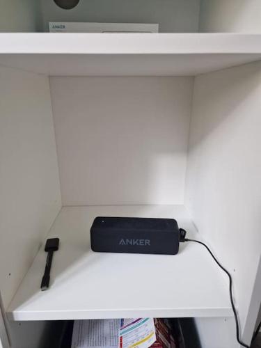 a black object sitting on top of a shelf at Appartement City Center in Vienna