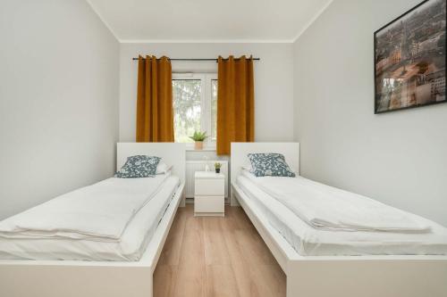 Postel nebo postele na pokoji v ubytování Stylowy Apartament z Parkingiem Łódź by Noclegi Renters