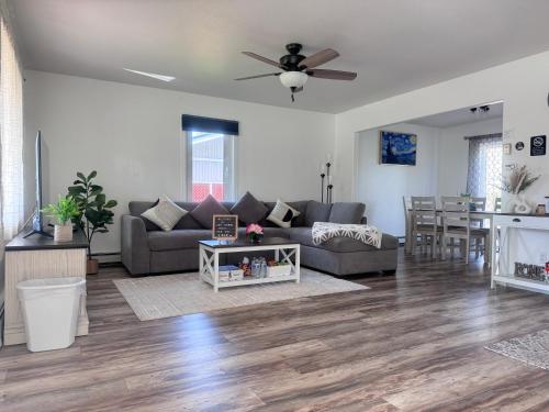 a living room with a couch and a table at Cozy Stay Retreat in Fairbanks