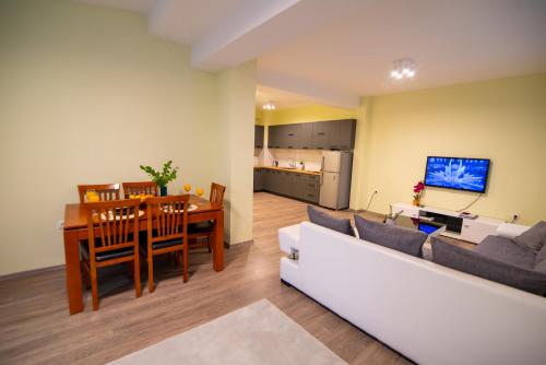 a living room with a white couch and a table at Oasis in Struga