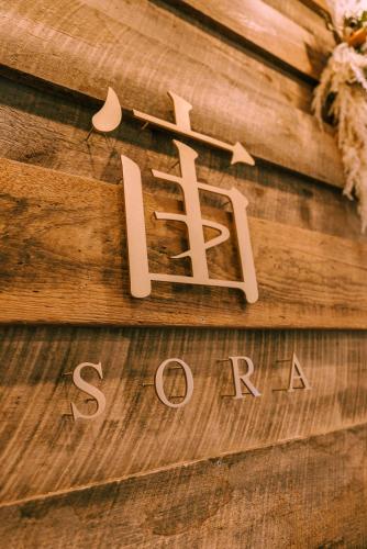 a wooden sign with the word sajad on it at 女性のための森サウナ 一棟貸し宿 SORA 宙 Forest sauna villa SORA in Komoro