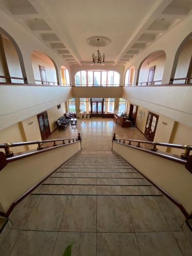 an empty hallway of a building with a staircase at Момент in Yuzhnoukrainsk 