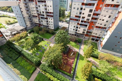 an aerial view of an apartment complex with trees and buildings at UniTerrace - Bicocca District in Milan