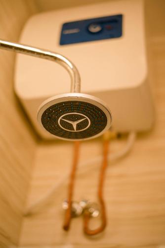 a close up of a toilet with a holder at Hecasa Apartments in Arusha